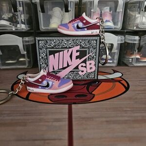 Nike SB pair of mini sneakers keychain.